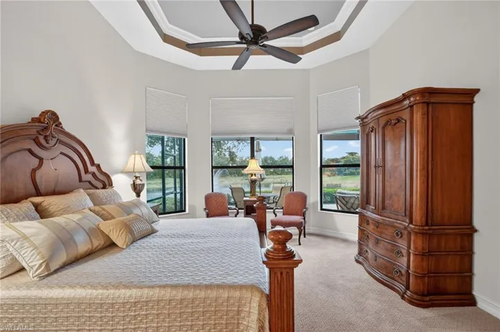 Bay window with impact hurricane glass featuring wide views of the lake and beyond (no rooftops in view)