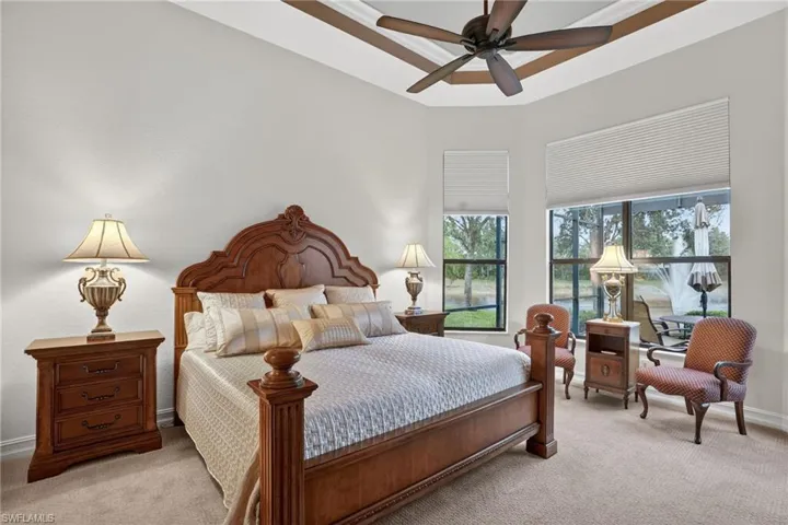 Large master suite, with outstanding views of the late and the water feature. This water feature is illuminated daily in the evening time, window treatments are operated with a remote