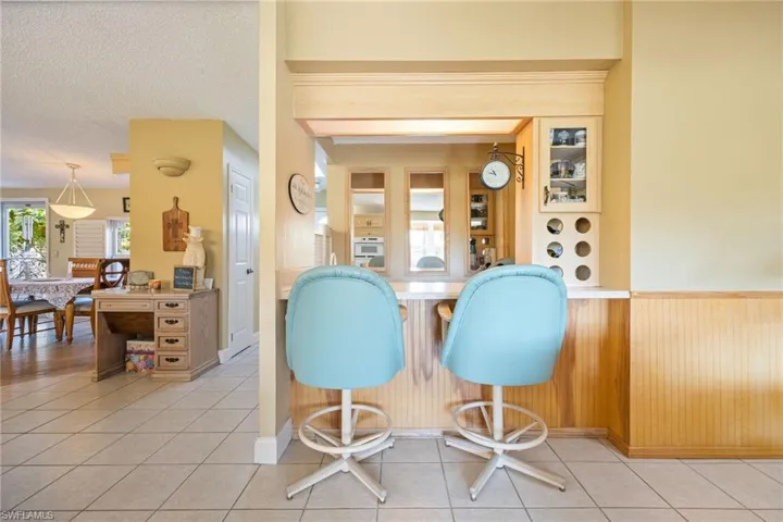 Wet bar with mini fridge and storage