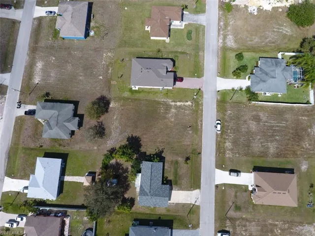 Another aerial looking north on NE 7th Avenue shows multiple houses in place and several vacant lots to bring newer homes to the area.