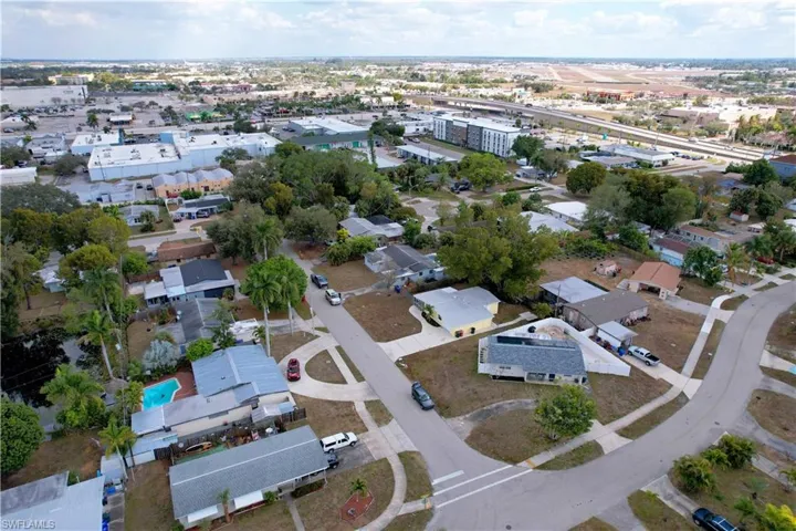 Aerial overview of property's location featuring nearby suburban area