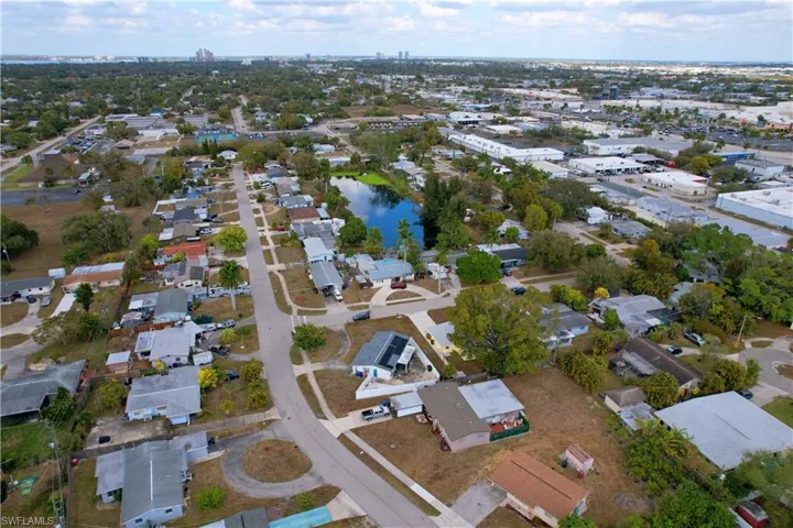 Aerial view of property's location with nearby suburban area