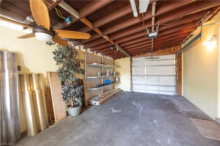 Garage featuring a garage door opener