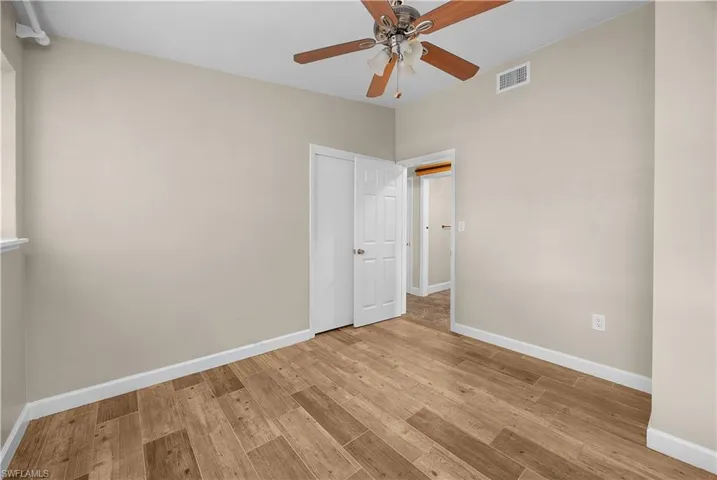 Unfurnished bedroom featuring light wood-type flooring and ceiling fan