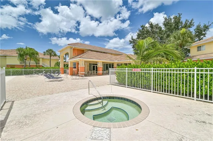View of pool featuring a patio and a community hot tub