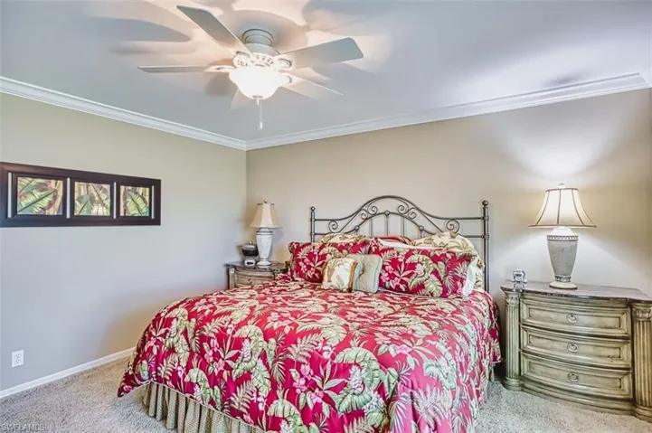Master Bedroom with crown molding, carpet flooring, and ceiling fan