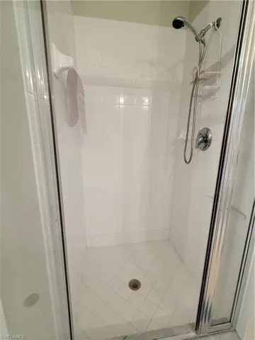 Bathroom featuring a shower stall