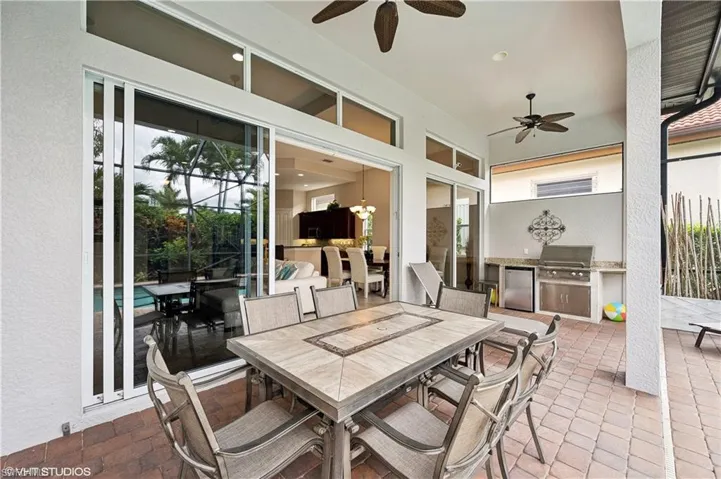 View of patio / terrace with grilling area and ceiling fan