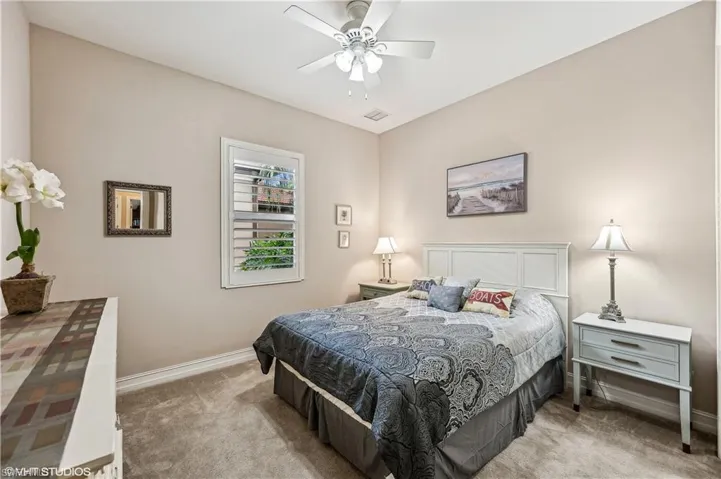 Bedroom with carpet and ceiling fan