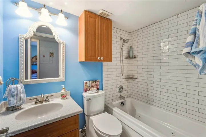 GUEST BATH JACUZZI TUB WITH SUBWAY TILE SURROUND