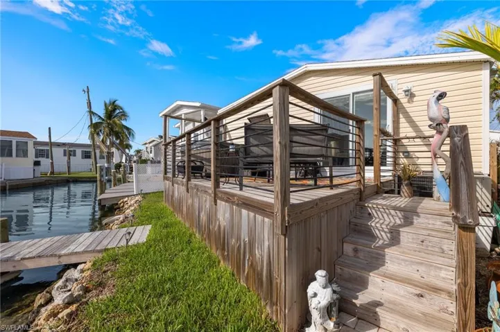 View of side of home with a boat dock