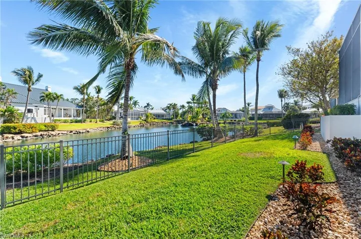 View of yard with a water view