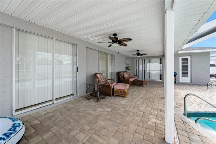 View of patio featuring a swimming pool and pool deck