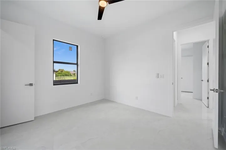 Spare room featuring baseboards and a ceiling fan
