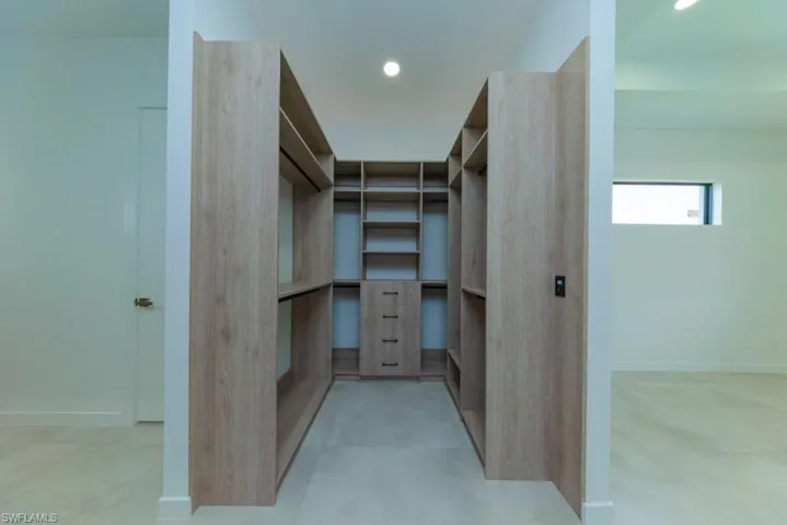 Spacious closet featuring light tile patterned floors