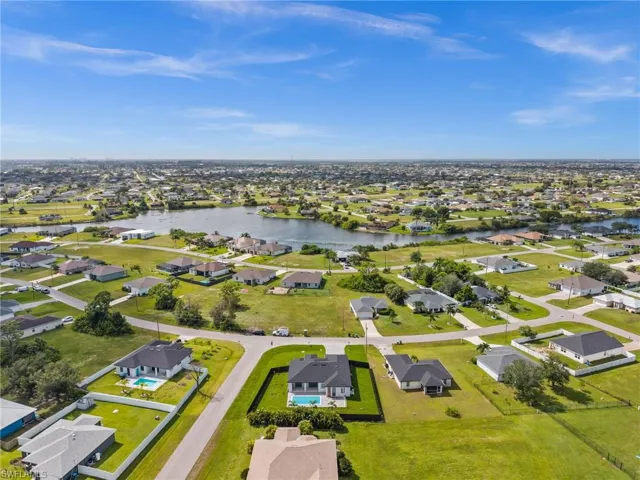 Aerial perspective of suburban area with a large body of water