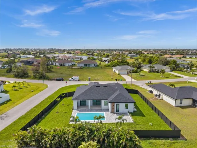 Aerial view of residential area featuring a pool area