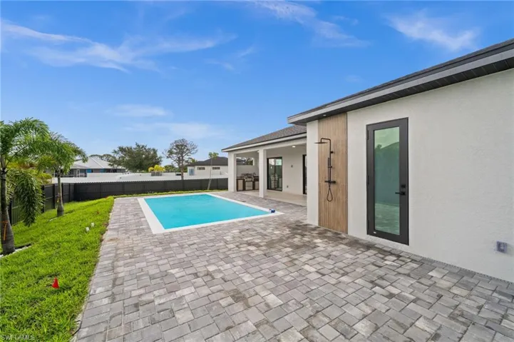 View of pool featuring a patio and a fenced backyard