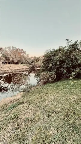 View of yard with a water view