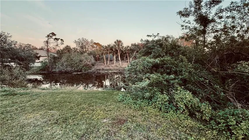 Nature at dusk featuring a water view