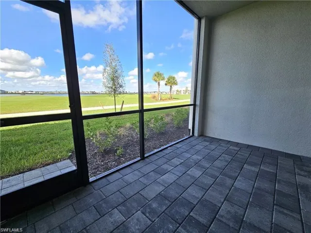 Unfurnished sunroom with view of golf course