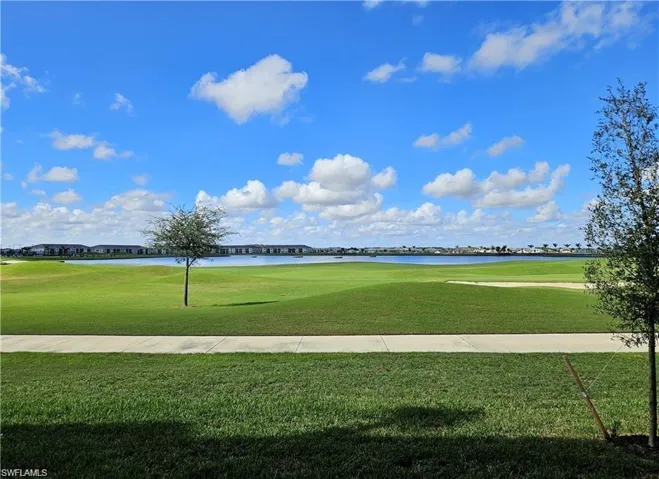 View of property's community featuring a water view and golf course view