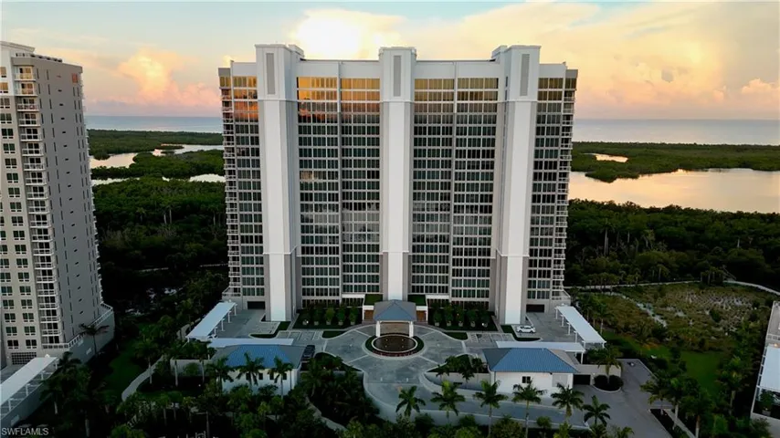 View of property with a water view