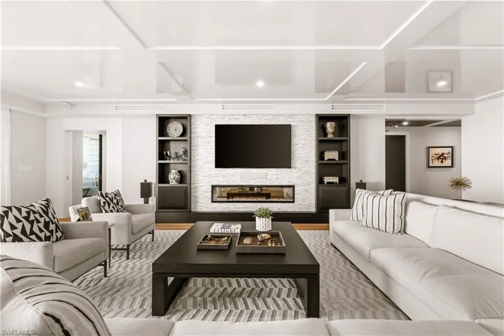Living area with a fireplace and wood finished floors