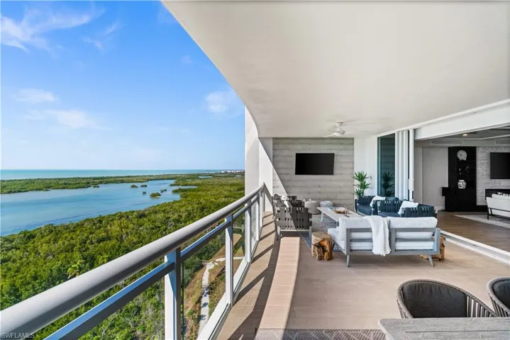 Balcony with an outdoor hangout area and ceiling fan
