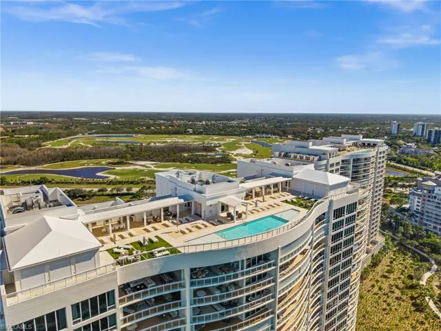 Aerial view of a large body of water and a pool area