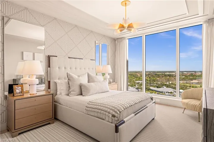 Carpeted bedroom featuring crown molding