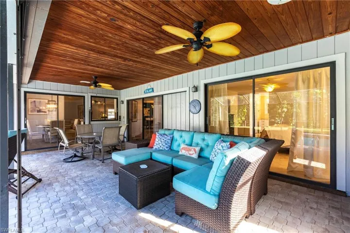 View of patio / terrace with a ceiling fan, an outdoor living space, and outdoor dining space
