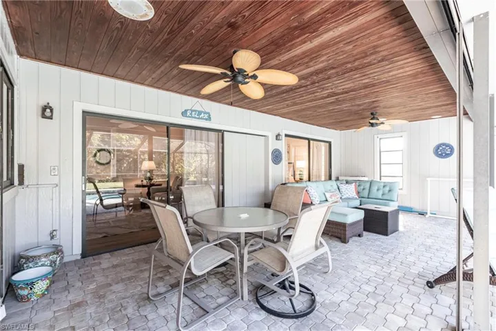 View of patio / terrace with an outdoor living space, ceiling fan, and outdoor dining space