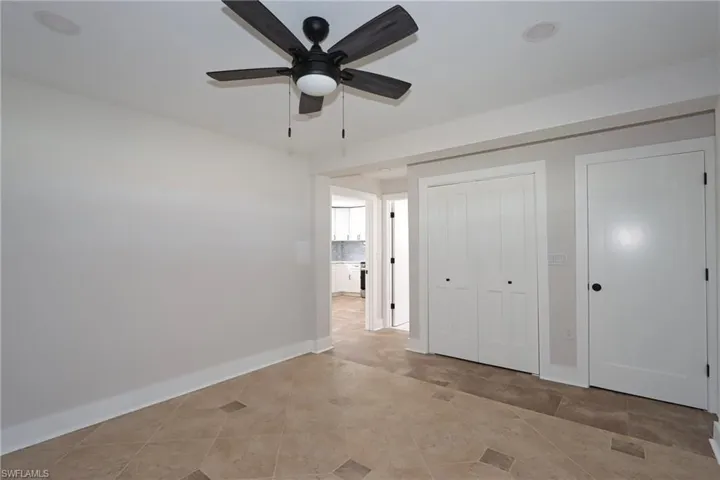 Unfurnished bedroom featuring a closet and a ceiling fan