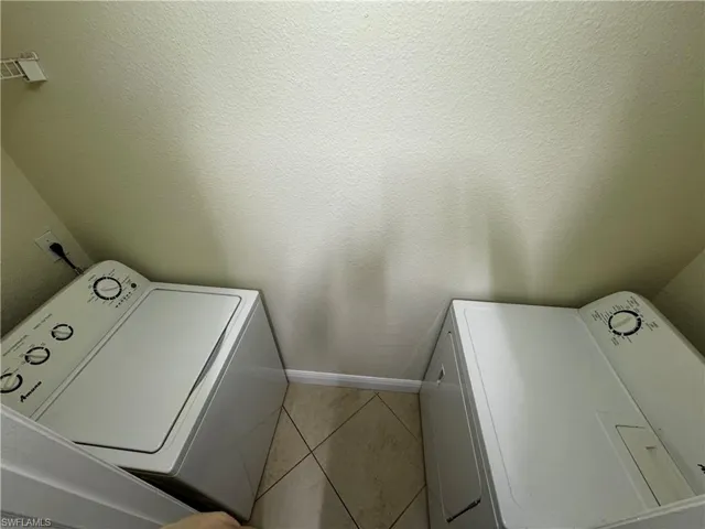 Laundry room featuring washer / clothes dryer and laundry area