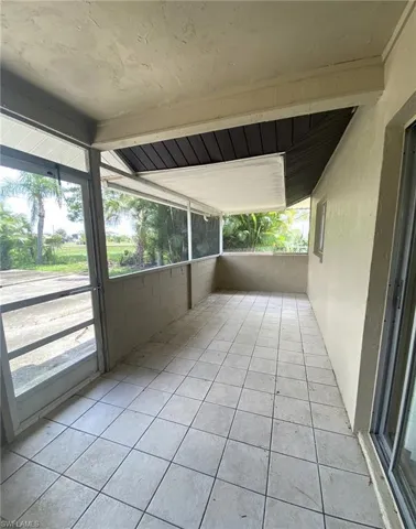 Tiled screened Lanai with privacy wall