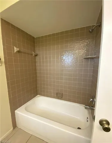 Master has a tiled Tub/Shower combination