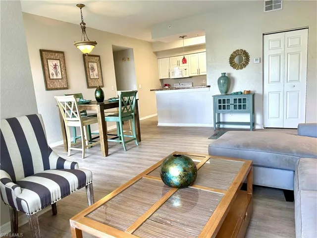 The great room, or living-dining area, is open to the kitchen.  Great for today's style of entertaining.
