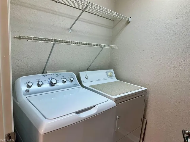 The in-residence laundry room is super convenient.  This area stores the ironing board, step ladder, and a vacuum, all off which is included.