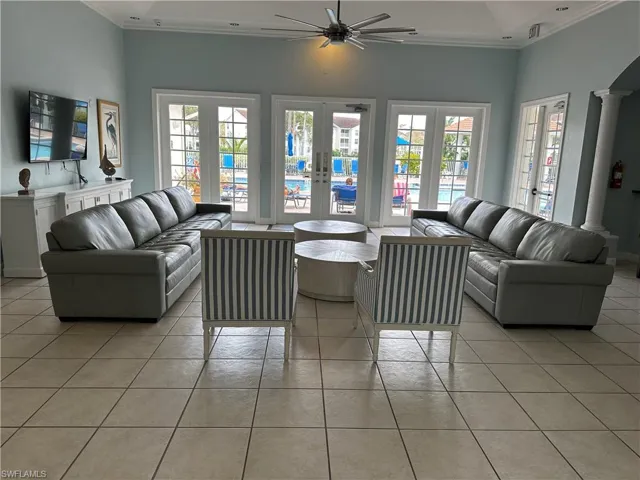 Interior of the clubhouse.  This lovely and comfortable space that is what you see as you enter the clubhouse.  Beyond the French doors is the community pool.