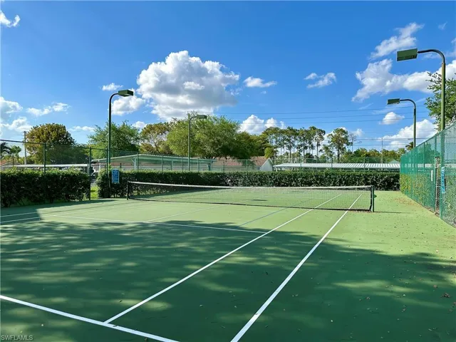 The court is lit for evening tennis.  Great exercise, with no cost.