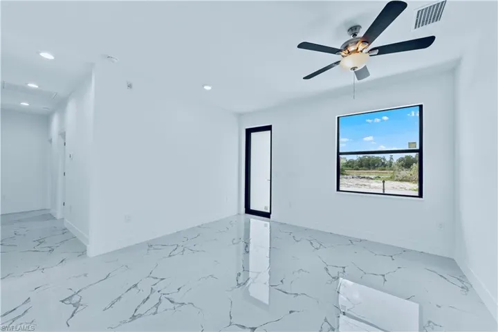 Spare room featuring ceiling fan
