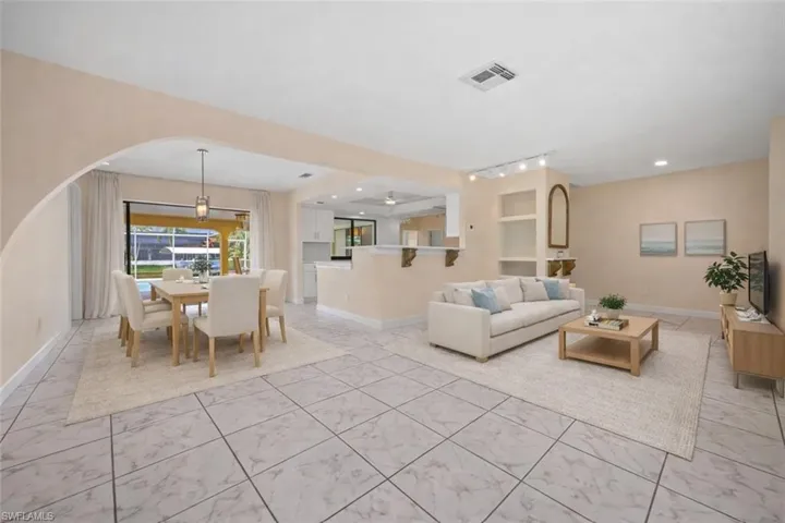 Virtually Staged Living Area with dining in the background