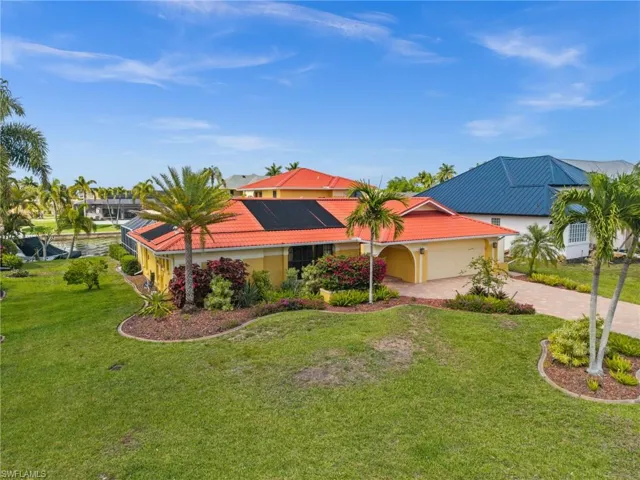 Lush Tropical Landscaping surrounds this remodeled 2 story home