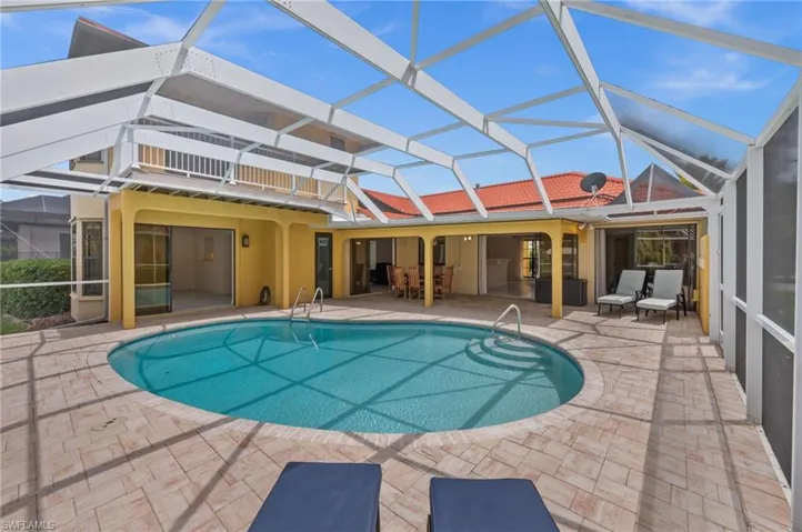 Lounging space surrounds the oversized, solar heated pool