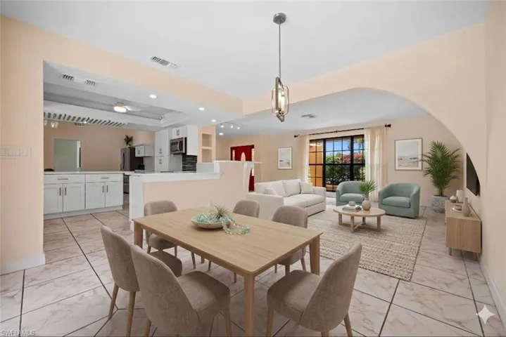 Virtually staged dining looking toward the front living area