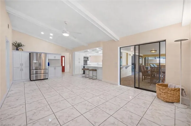 The Family Room is just steps from the pool. *Virtually staged, furniture was removed
