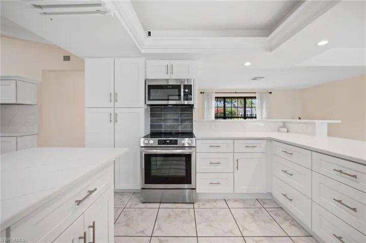 All stainless appliances and quartz countertops in the kitchen