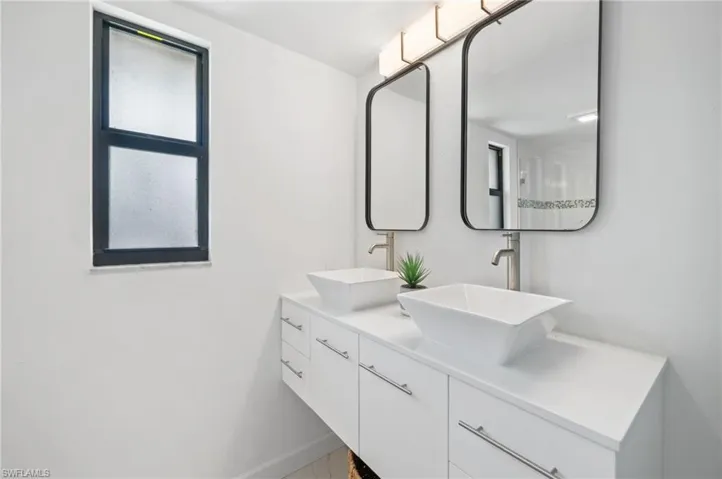 Main floor primary bath with dual sinks