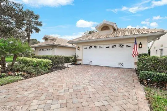 Mediterranean / spanish-style house featuring a garage